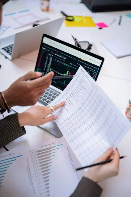 A top view on charts and smartphone in an office, showcasing data analytics.